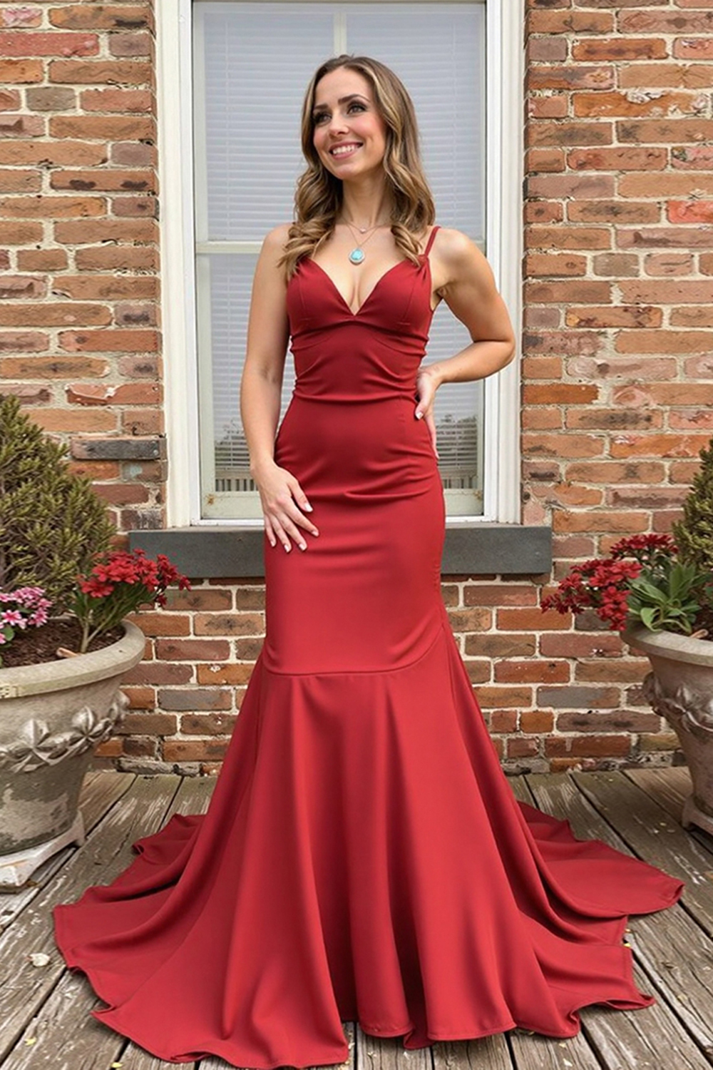 Long Red Prom Dress with Deep V-Neck Mermaid Cut and Spaghetti Straps Featuring a Bow