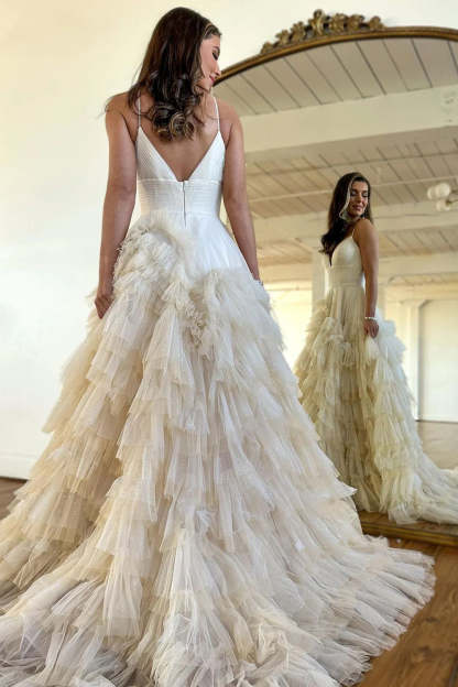 Pink long prom dress with spaghetti straps and ruffles in A-line style