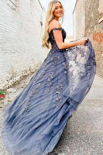Prom dress in navy featuring off-the-shoulder design and appliques