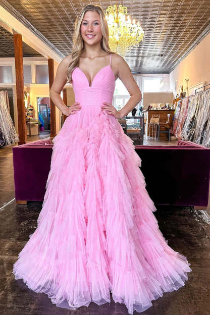 Pink long prom dress with spaghetti straps and ruffles in A-line style