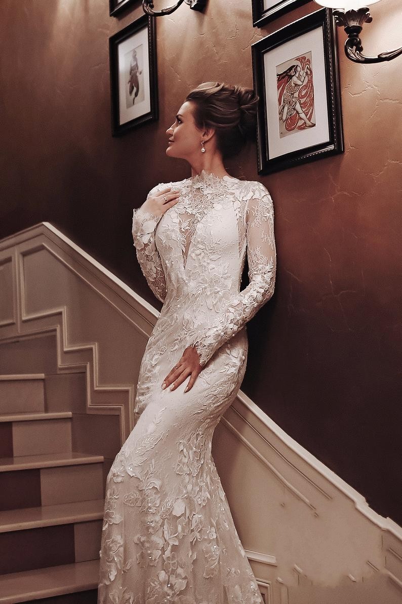 Charming White High Neck Backless Mermaid Long Sleeve Wedding Dress with Appliques Lace