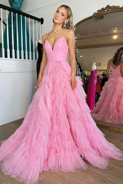 Pink long prom dress with spaghetti straps and ruffles in A-line style