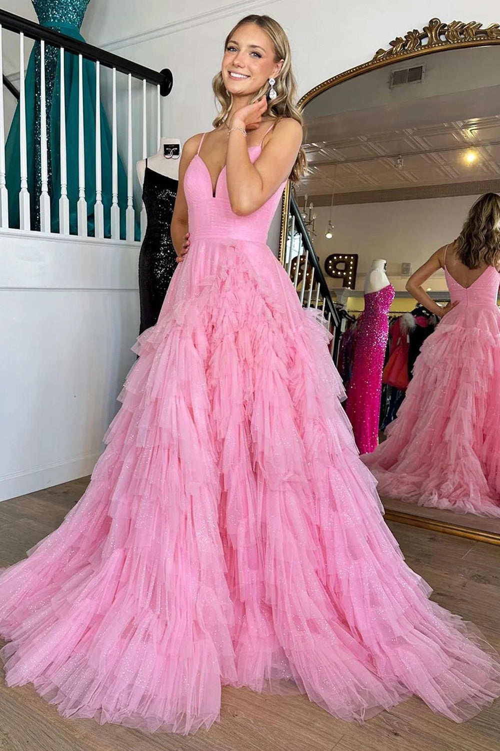 Pink long prom dress with spaghetti straps and ruffles in A-line style