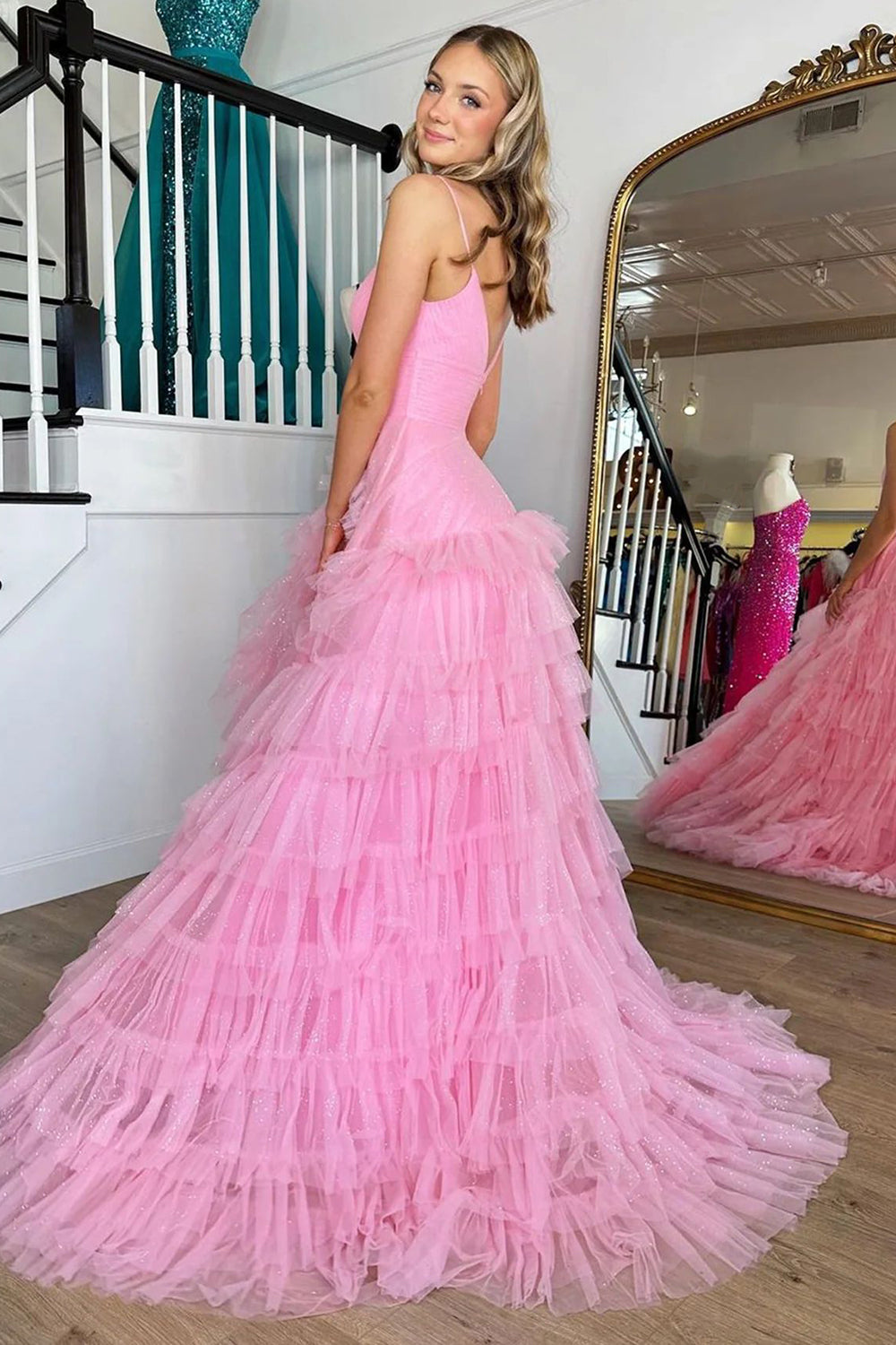Pink long prom dress with spaghetti straps and ruffles in A-line style