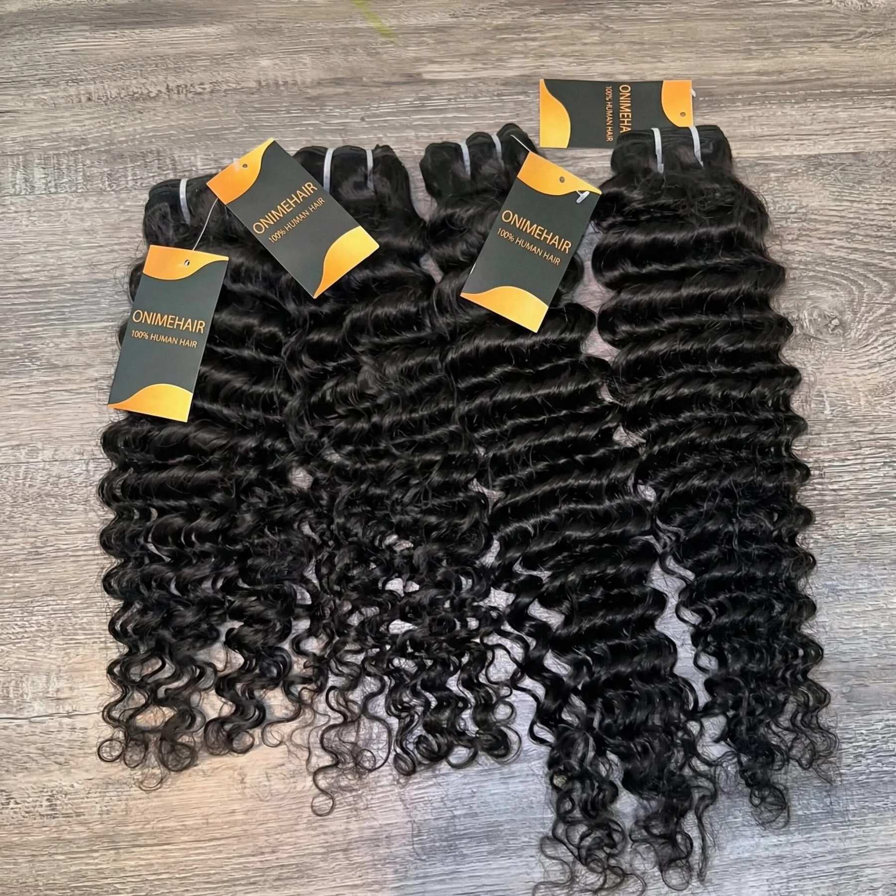 10A Grade Deep Curly Wave Bundles of 100% Human Virgin Hair Extensions in rich, bouncy curls.