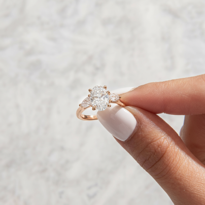 Stunning Rose Gold Three-Stone Engagement Ring