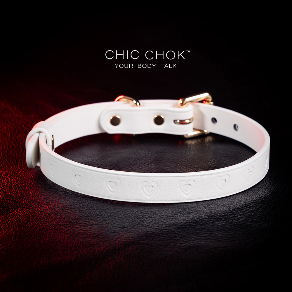 chicchok choker Chic white leather choker with embossed heart patterns and gold metal accents, featuring an adjustable design that blends purity and sophistication for all occasions.