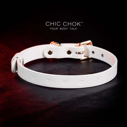 chicchok choker Chic white leather choker with embossed heart patterns and gold metal accents, featuring an adjustable design that blends purity and sophistication for all occasions.