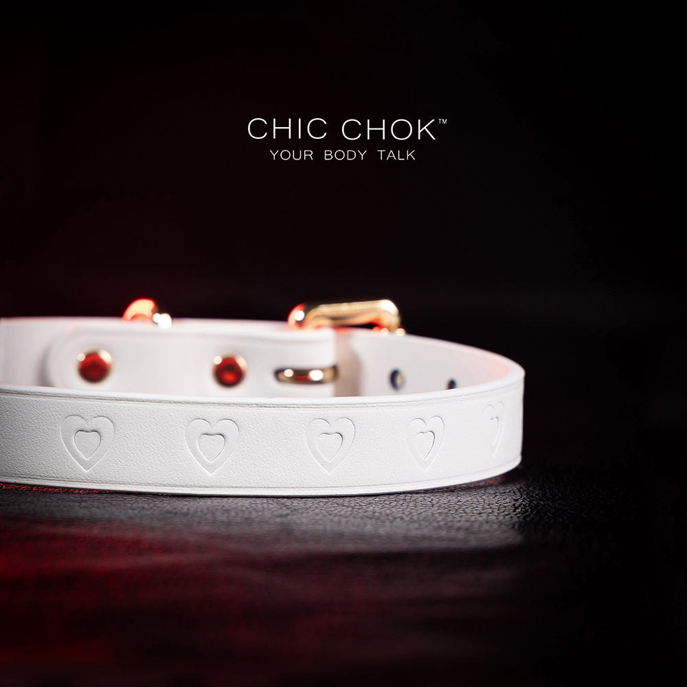 chicchok choker Chic white leather choker with embossed heart patterns and gold metal accents, featuring an adjustable design that blends purity and sophistication for all occasions.
