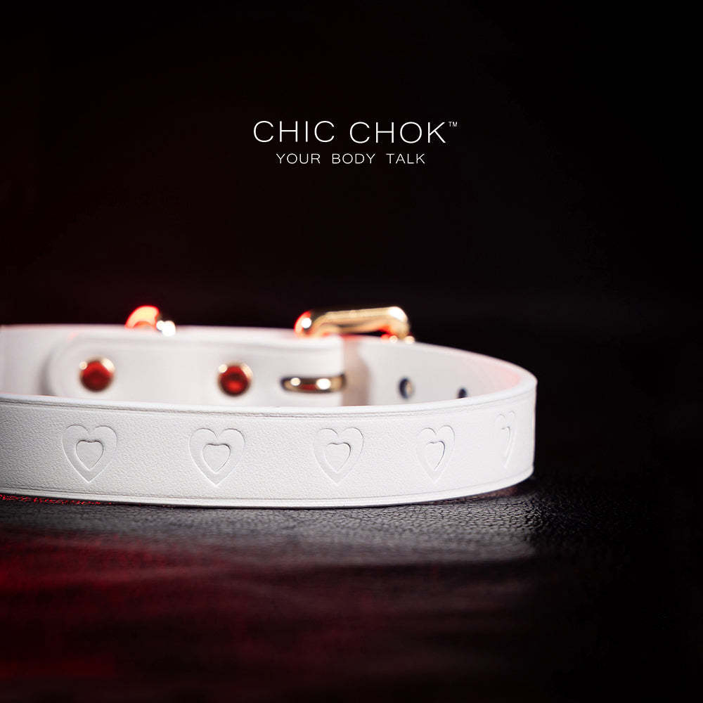 chicchok choker Chic white leather choker with embossed heart patterns and gold metal accents, featuring an adjustable design that blends purity and sophistication for all occasions.
