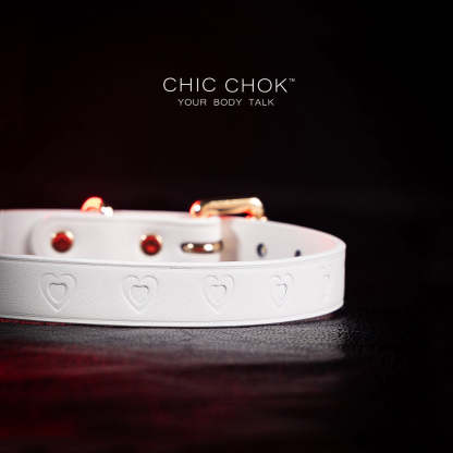 chicchok choker Chic white leather choker with embossed heart patterns and gold metal accents, featuring an adjustable design that blends purity and sophistication for all occasions.