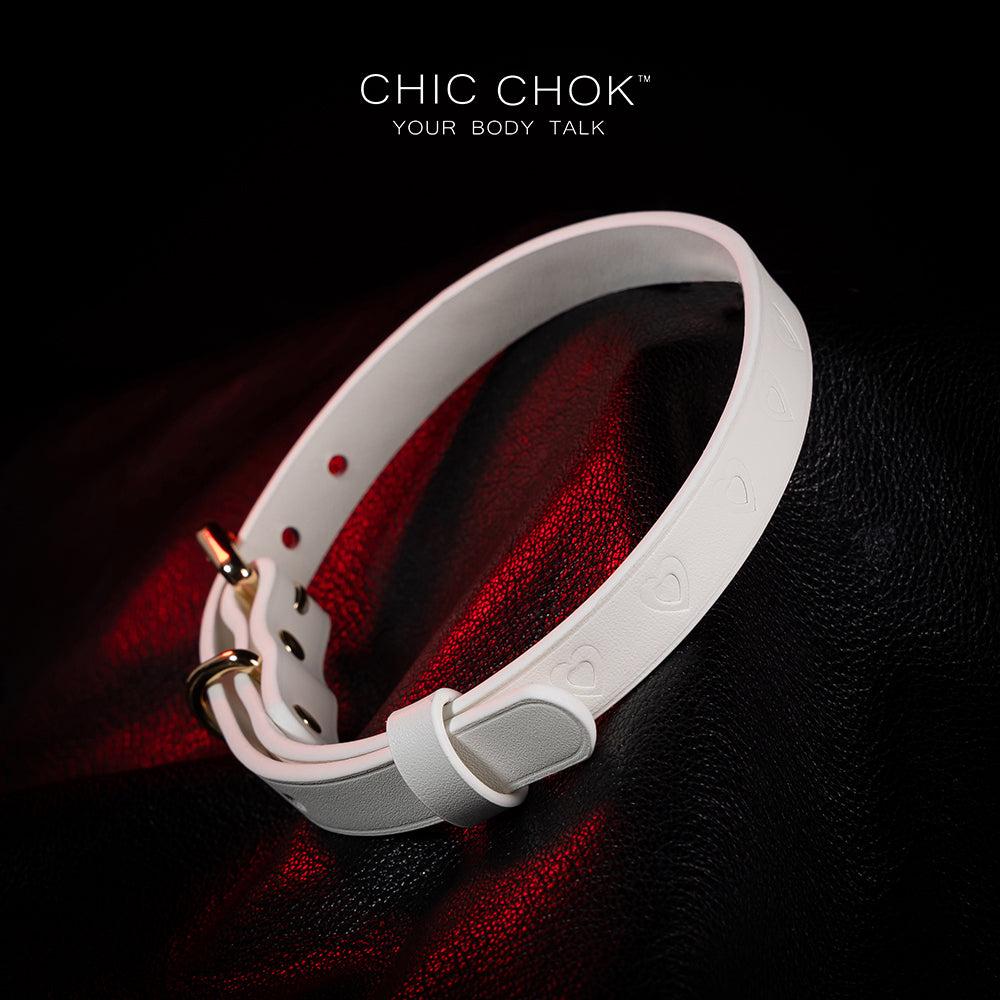 chicchok choker Chic white leather choker with embossed heart patterns and gold metal accents, featuring an adjustable design that blends purity and sophistication for all occasions.