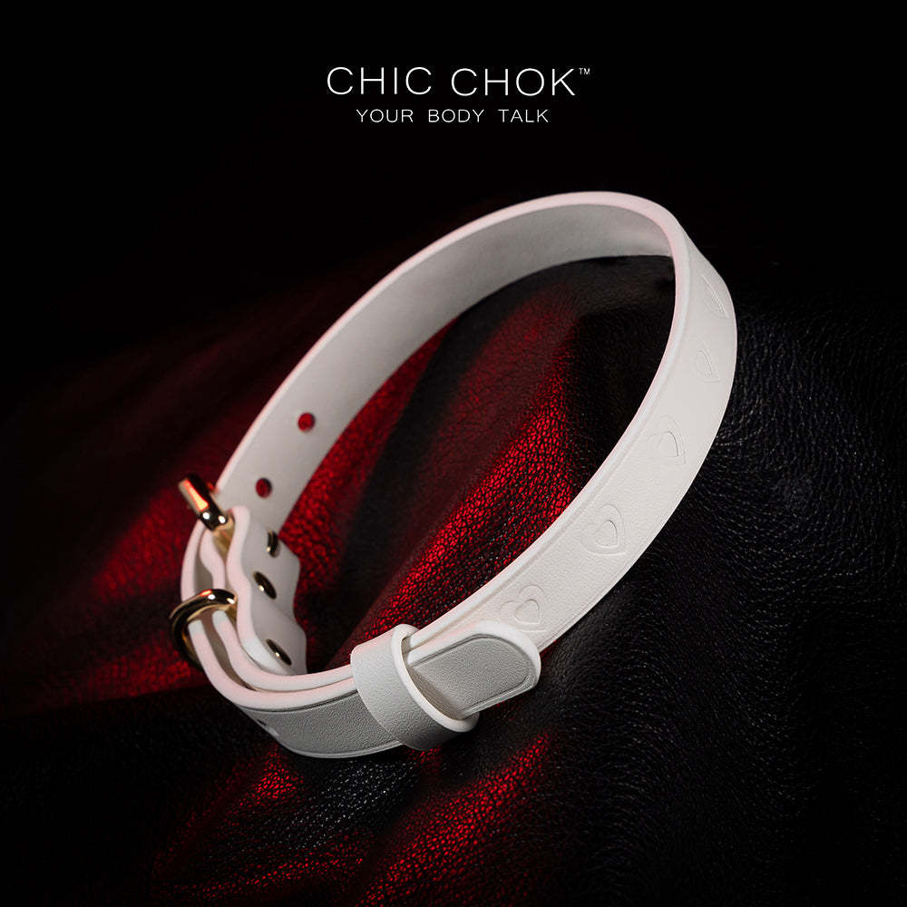 chicchok choker Chic white leather choker with embossed heart patterns and gold metal accents, featuring an adjustable design that blends purity and sophistication for all occasions.