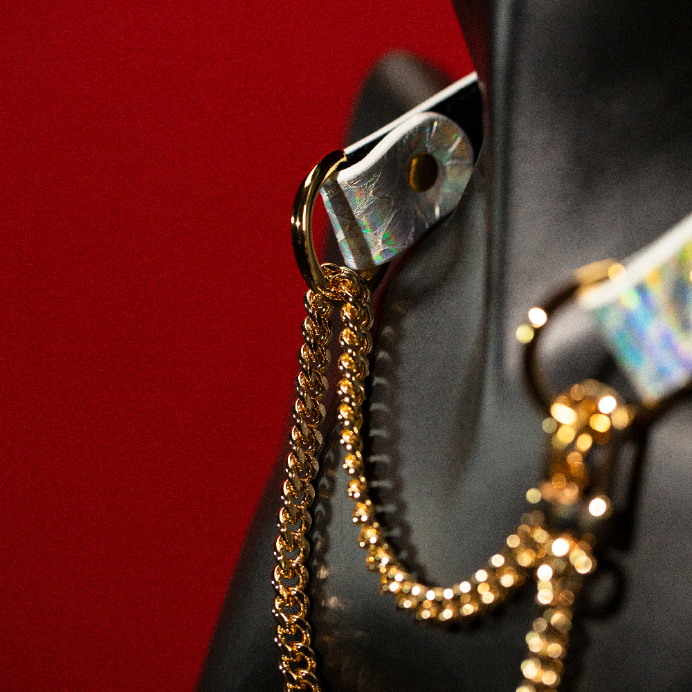 chicchok breathless choker featuring a white textured design with iridescent scales that reflect vibrant rainbow colors