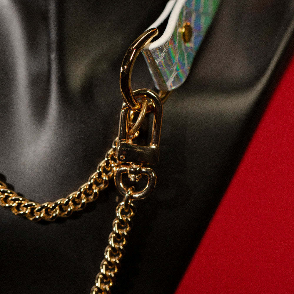 chicchok breathless choker featuring a white textured design with iridescent scales that reflect vibrant rainbow colors