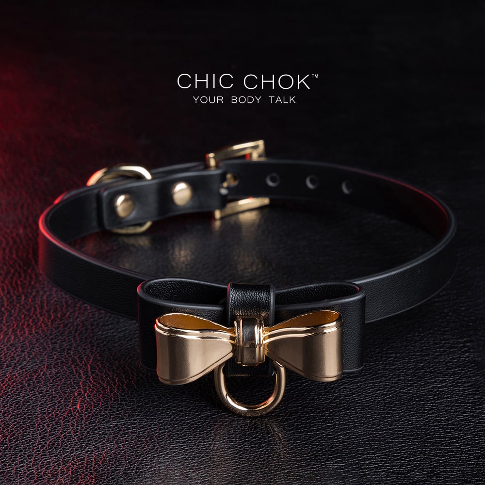 Elegant choker featuring a golden bow design symbolizing nobility, unity, and individuality, set against a vibrant color contrast to represent diverse social statuses, personalities, and backgrounds while celebrating love and mutual respect.