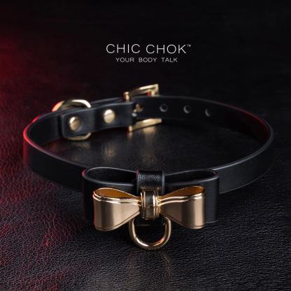 Elegant choker featuring a golden bow design symbolizing nobility, unity, and individuality, set against a vibrant color contrast to represent diverse social statuses, personalities, and backgrounds while celebrating love and mutual respect.