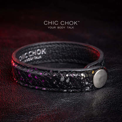 Nebula Doll Bracelet Luxurious black leather bracelet with textured scales, adorned with shimmering multicolor glitter accents, inspired by the brilliance of a starry night sky, showcasing elegance and individuality.