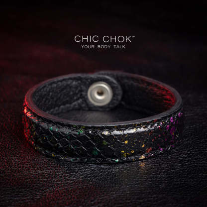 Nebula Doll Bracelet Luxurious black leather bracelet with textured scales, adorned with shimmering multicolor glitter accents, inspired by the brilliance of a starry night sky, showcasing elegance and individuality.