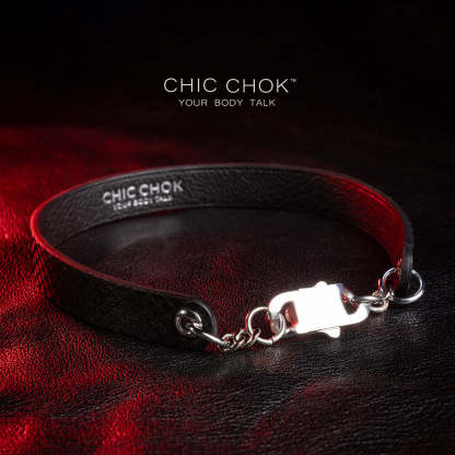 The chicchok black leather collar jewelry has a snakeskin texture on the surface, paired with silver chain and buckle details, showing a combination of elegance and personality.