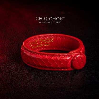 chicchok red scaled leather bracelet featuring a bold circular clasp and luxurious gold branding, designed to inspire confidence and elevate any outfit