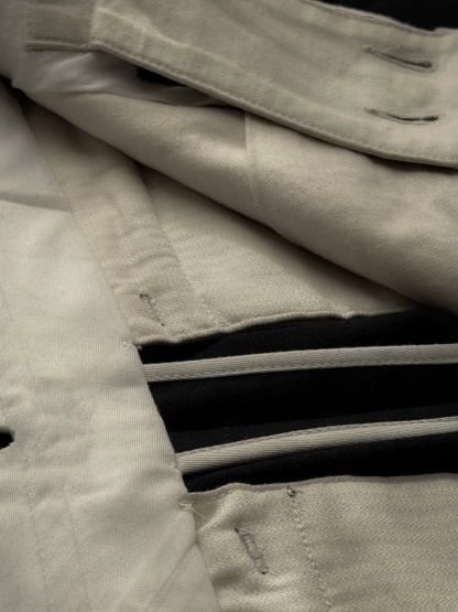 THE TAILORED PLEATED TROUSERS