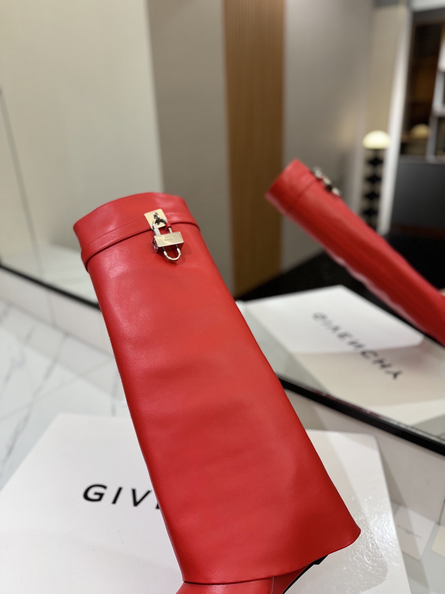 High-heeled buckle boots