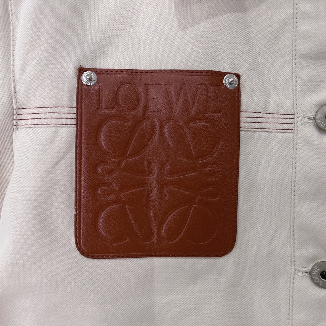 L style Denim jacket with leather patch pockets and lapel