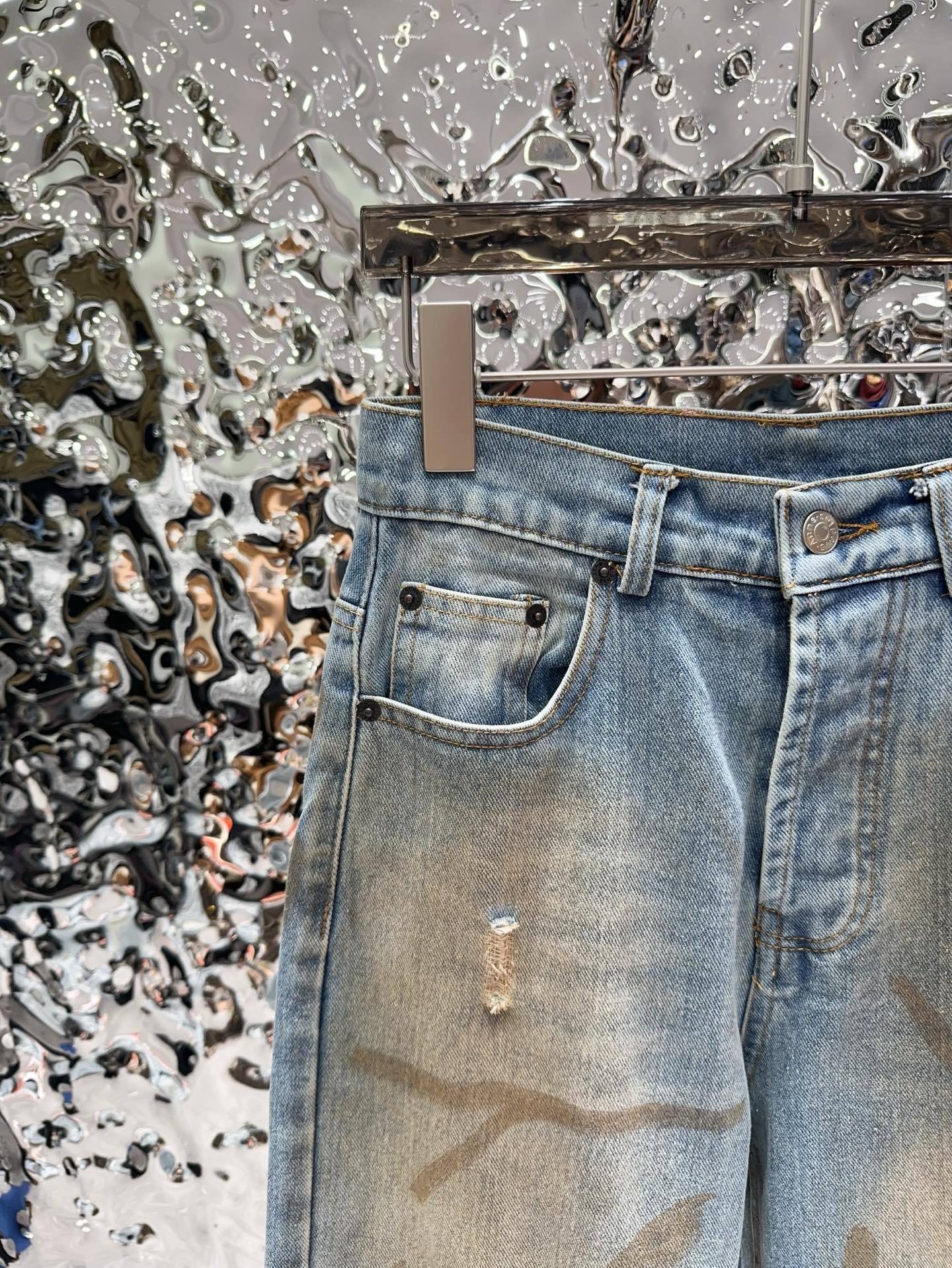 Slightly ripped, mud-dyed, distressed, washed, and dirty pants