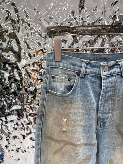 Slightly ripped, mud-dyed, distressed, washed, and dirty pants