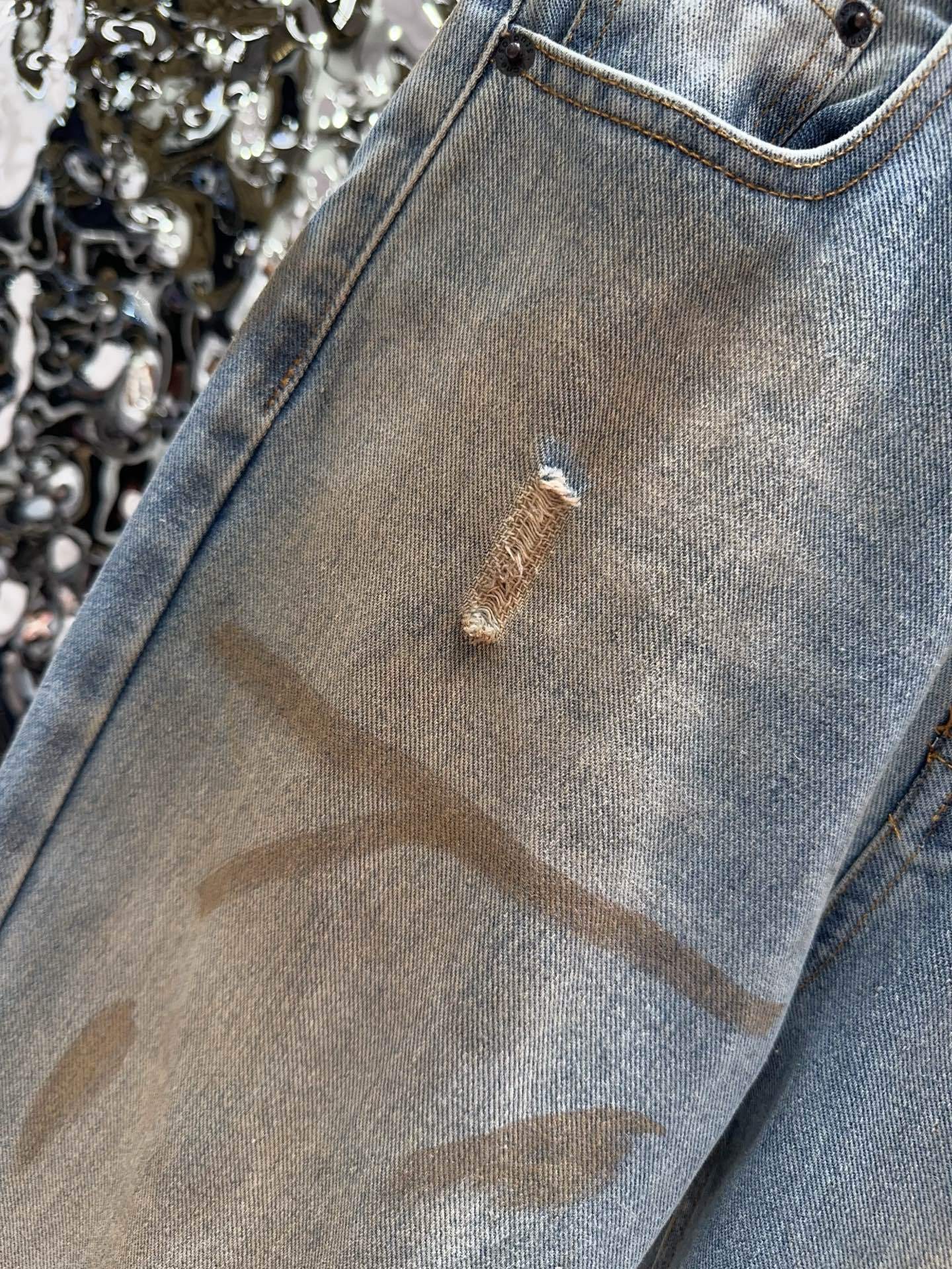 Slightly ripped, mud-dyed, distressed, washed, and dirty pants