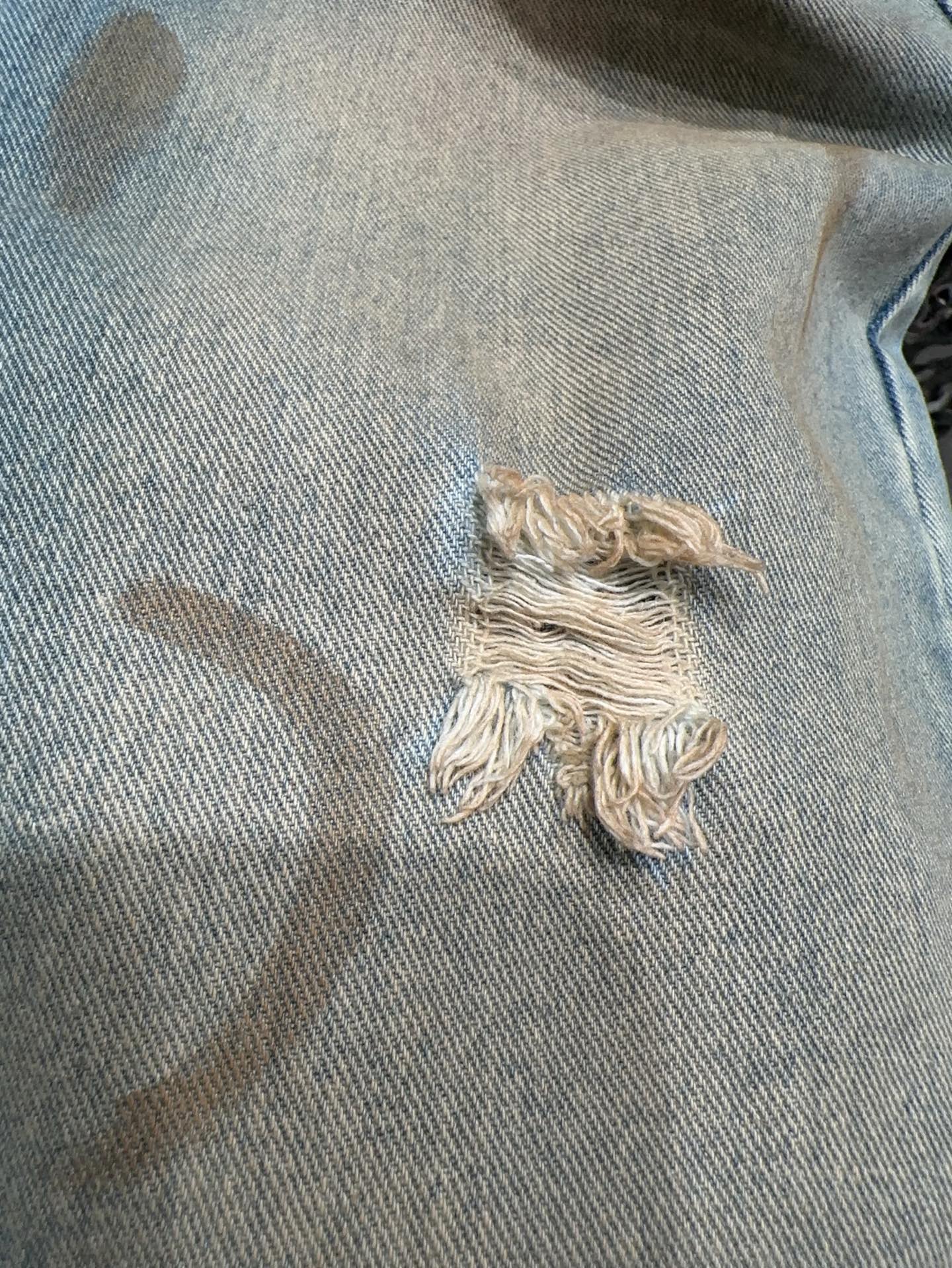 Slightly ripped, mud-dyed, distressed, washed, and dirty pants