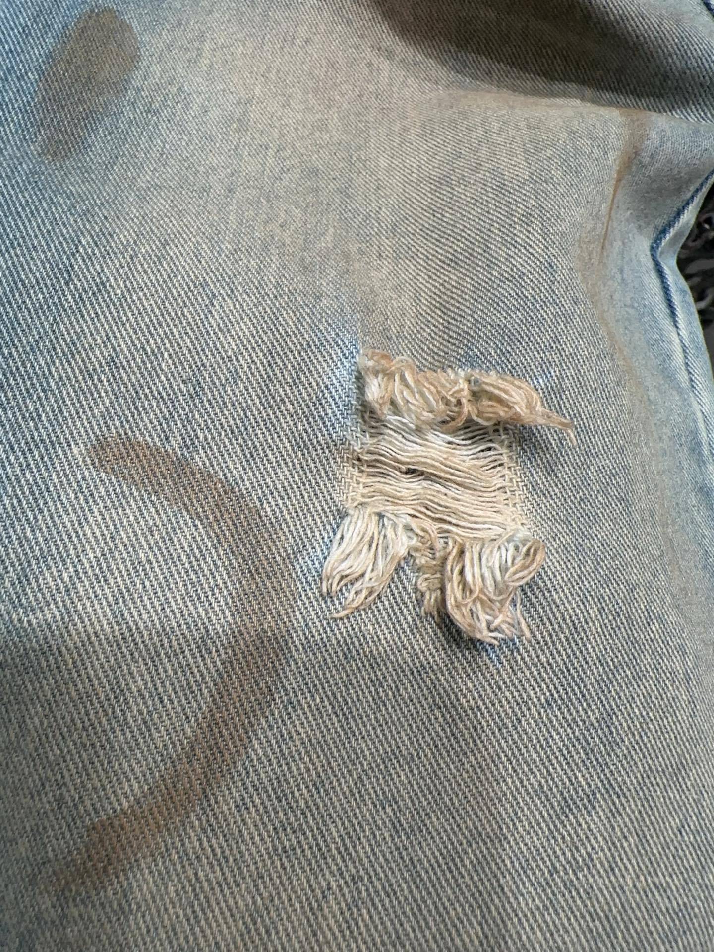 Slightly ripped, mud-dyed, distressed, washed, and dirty pants