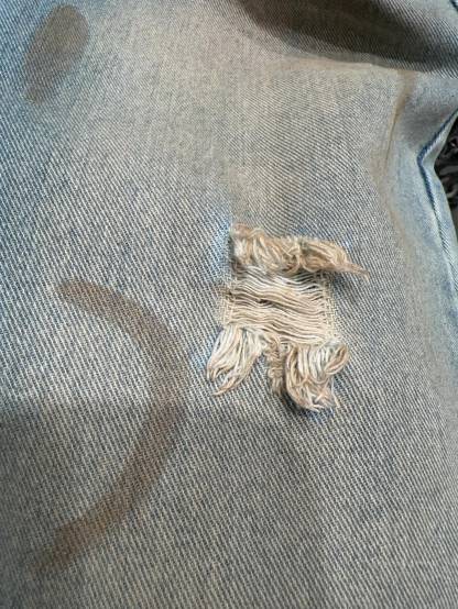 Slightly ripped, mud-dyed, distressed, washed, and dirty pants