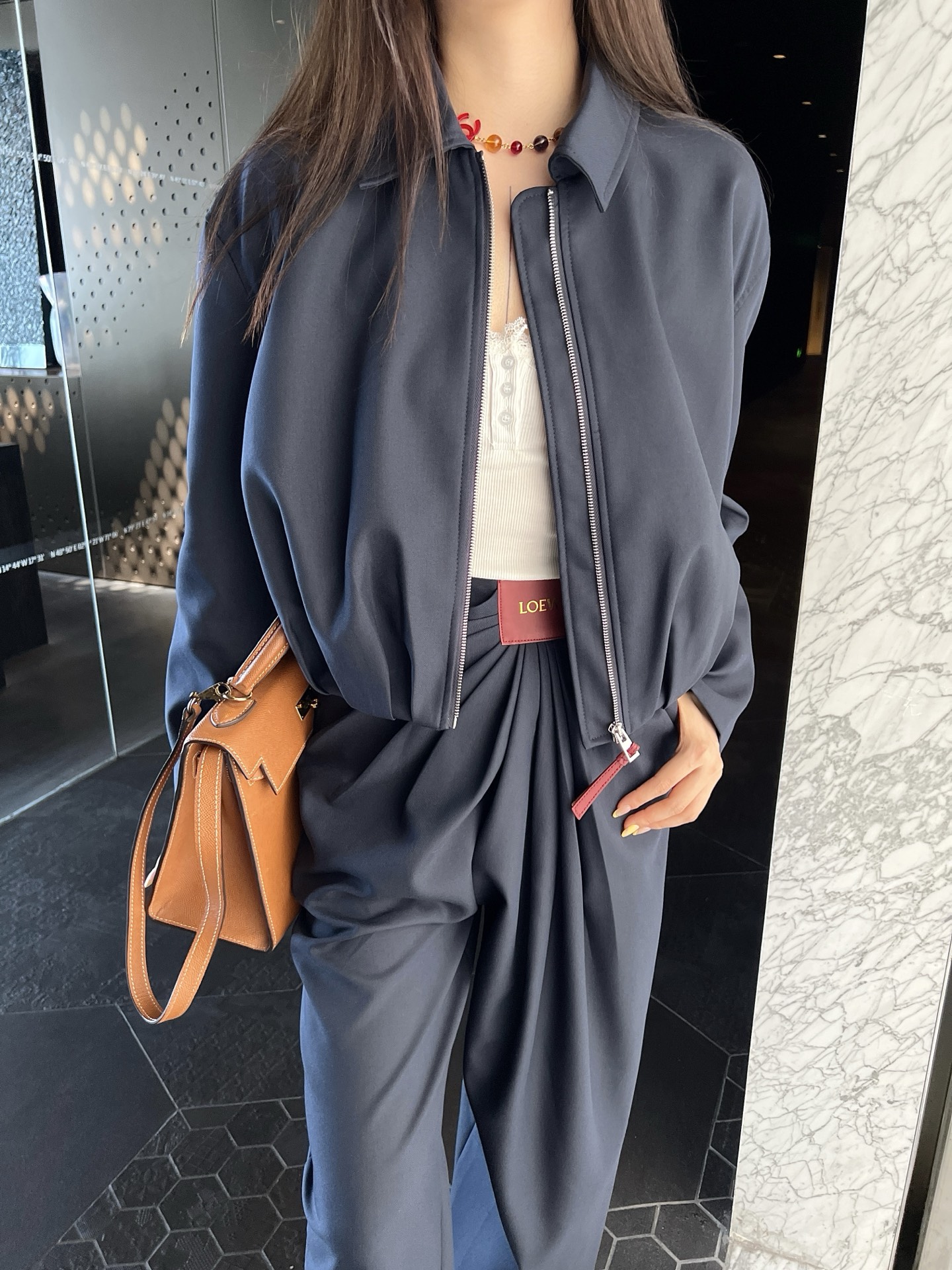 Zippered leather jacket and trousers set