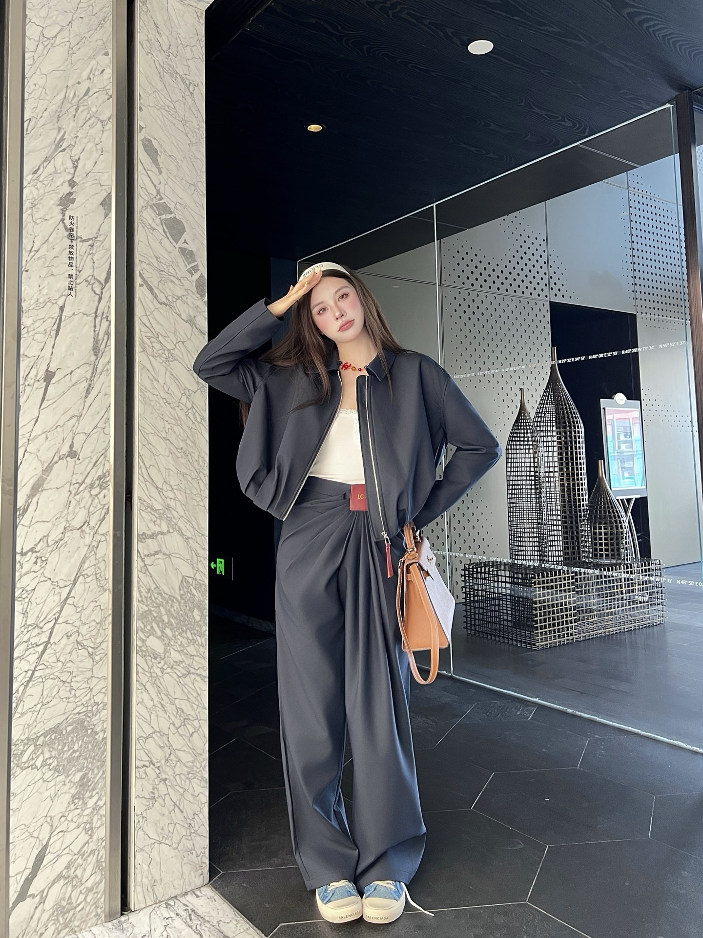 Zippered leather jacket and trousers set