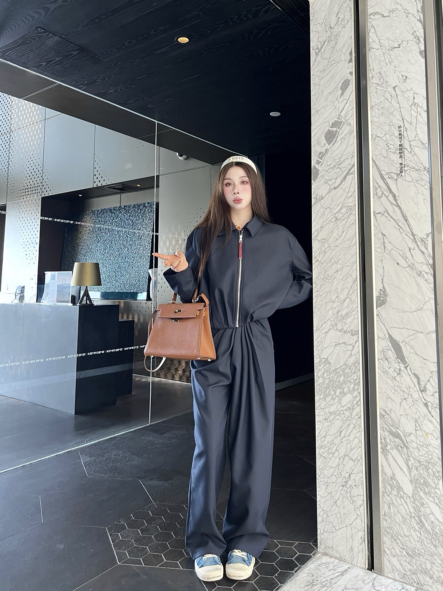 Zippered leather jacket and trousers set