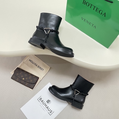 Knotted combat boots