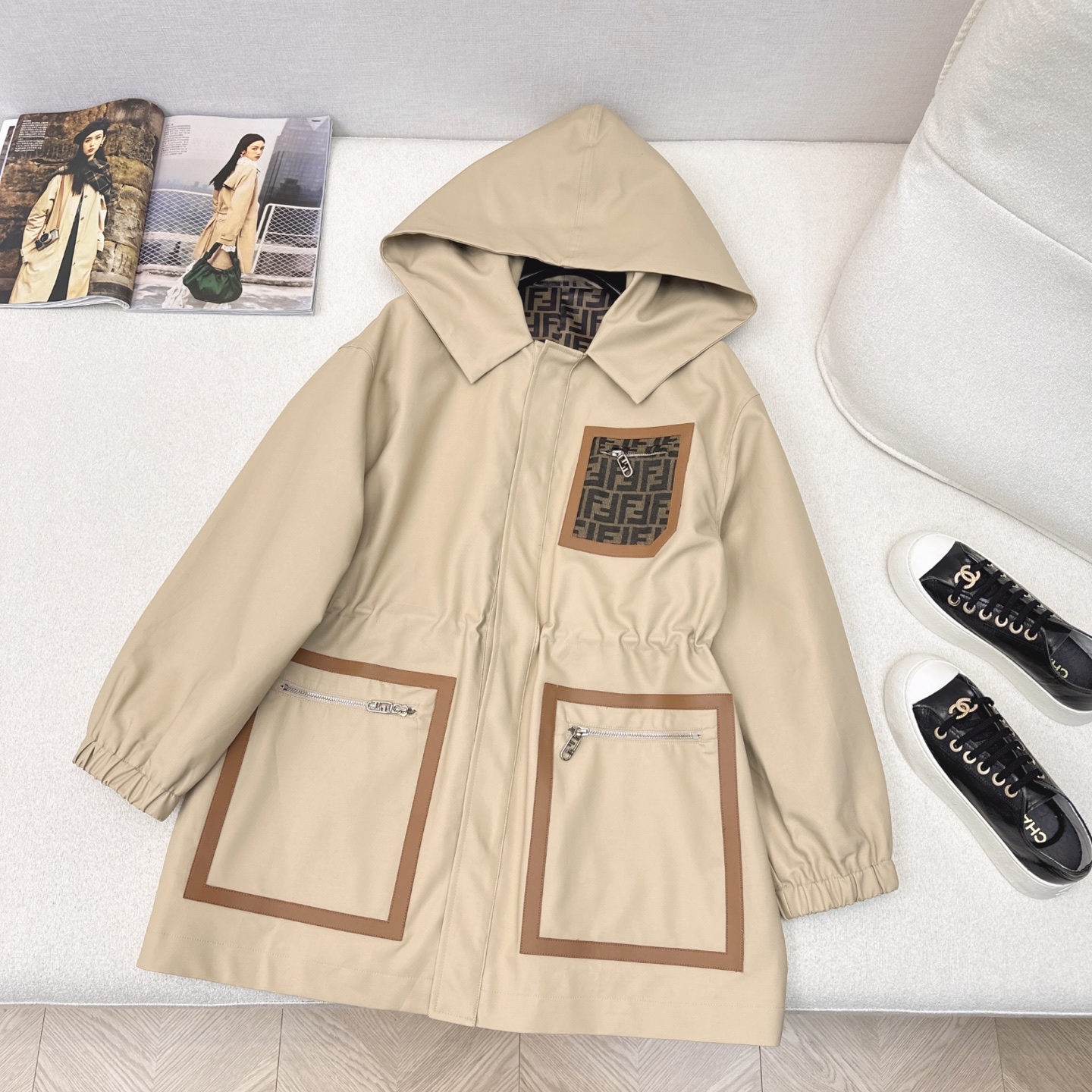 Waisted trench coat with monogram pockets