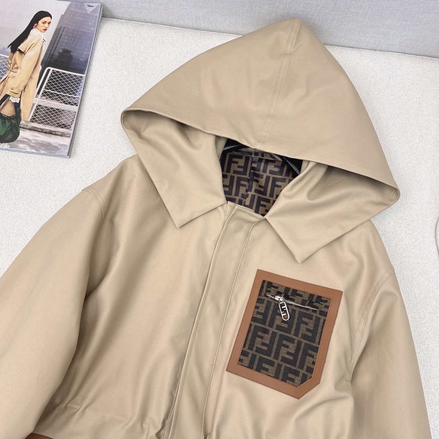Waisted trench coat with monogram pockets