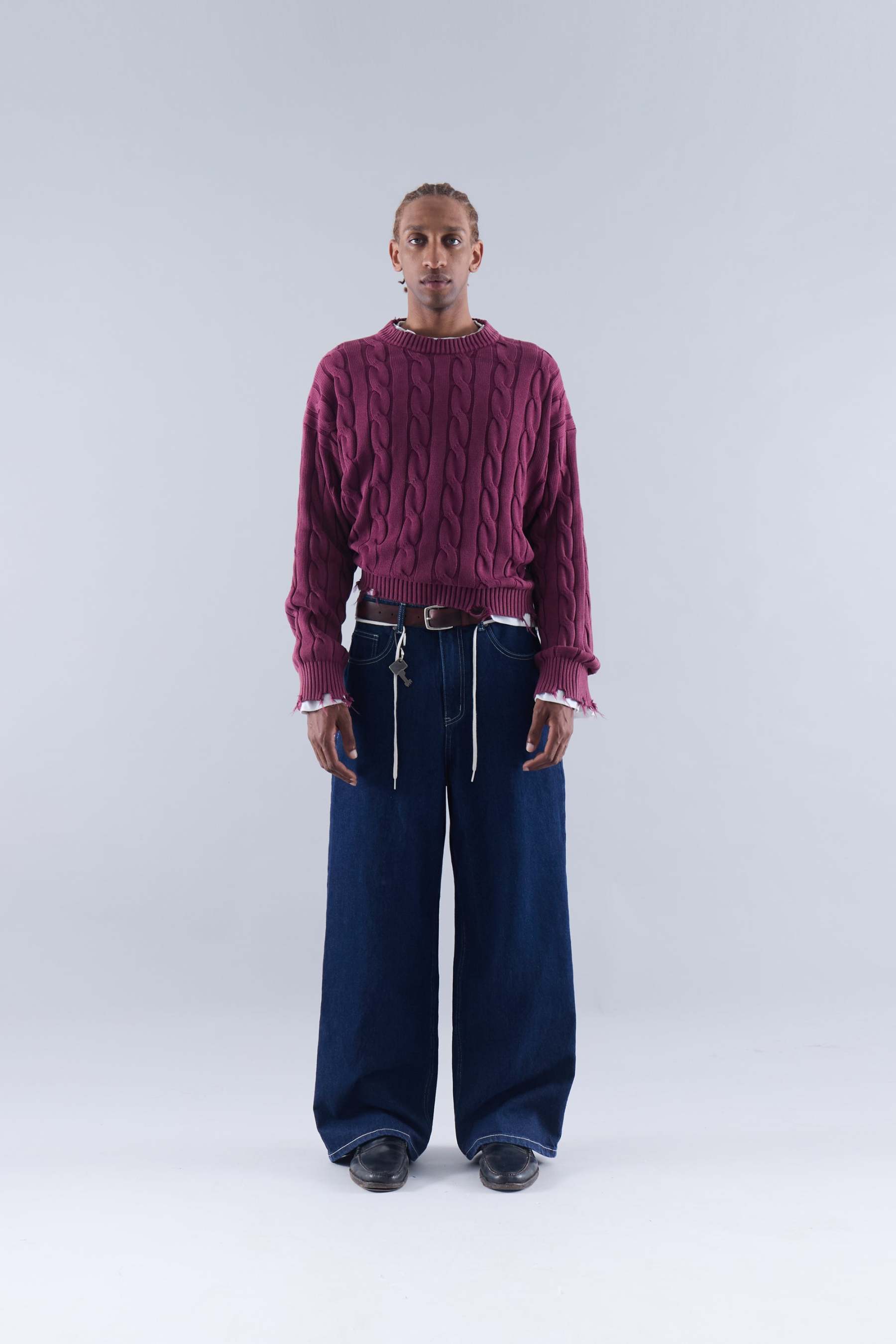 CABLE KNIT DISTRESSED SWEATER