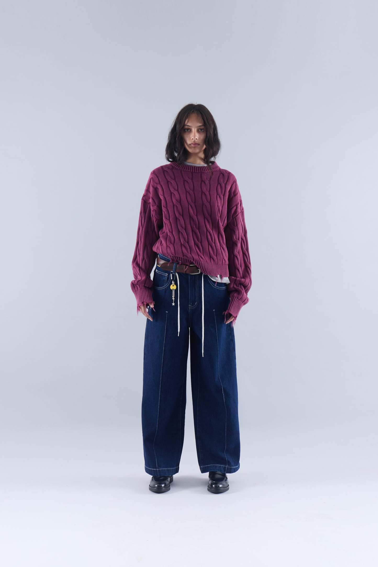 CABLE KNIT DISTRESSED SWEATER