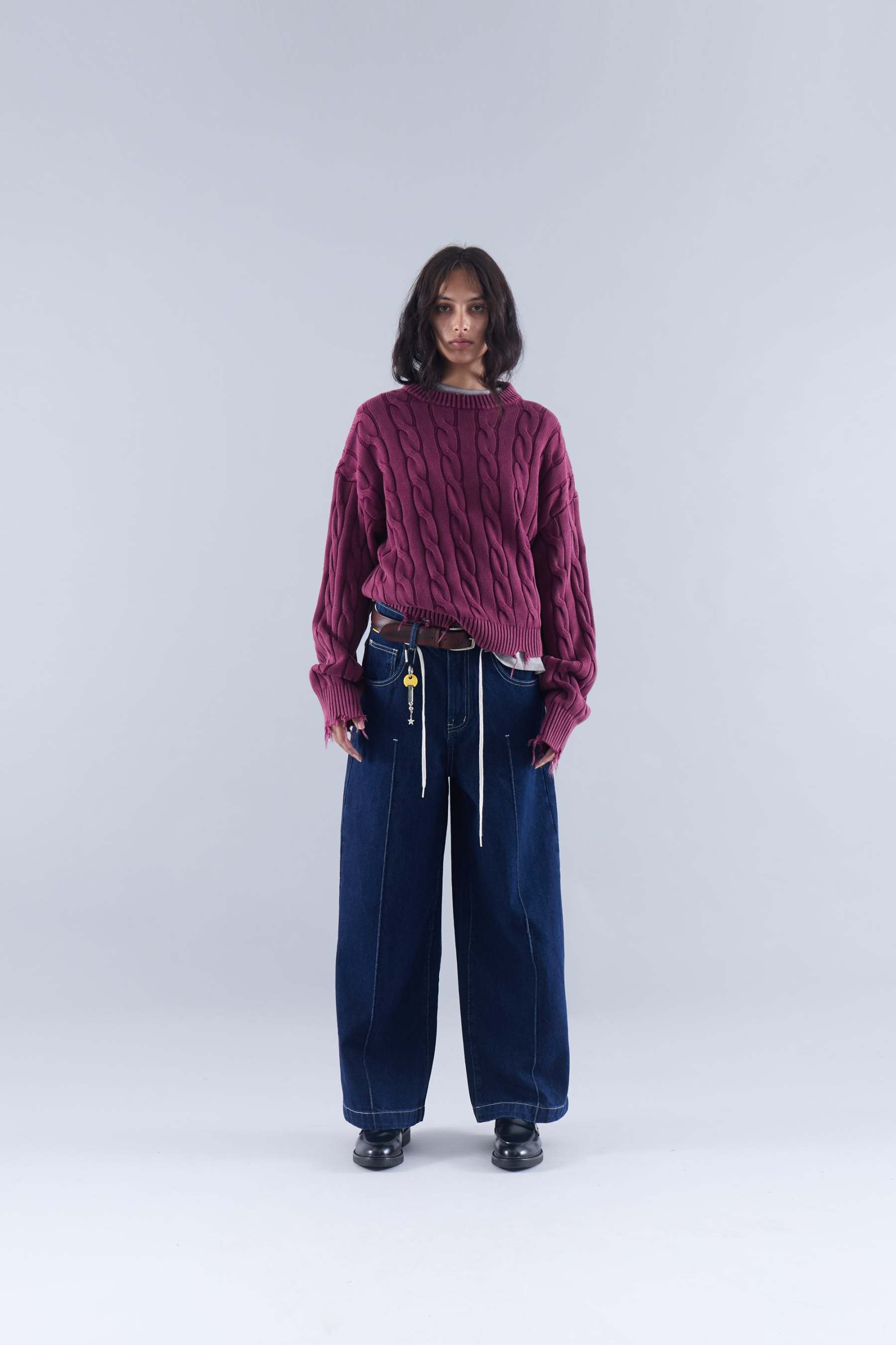 CABLE KNIT DISTRESSED SWEATER