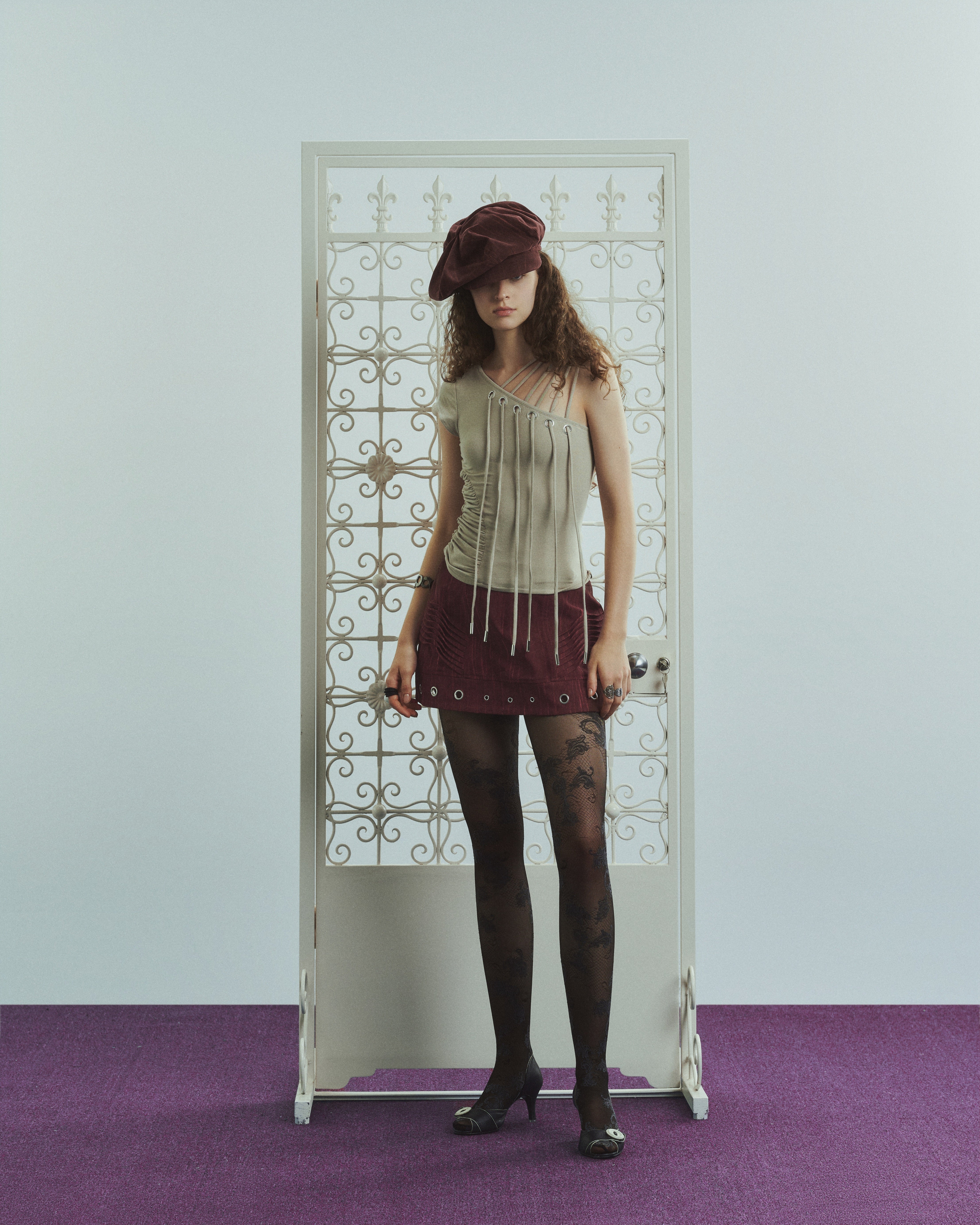 Asymmetrical Cutout Lace-Up Sleeveless Top
