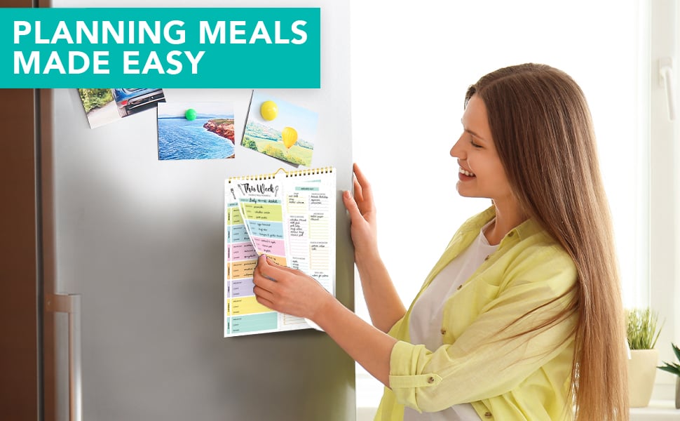 The woman is displaying the meal planning pad in the refrigerator.