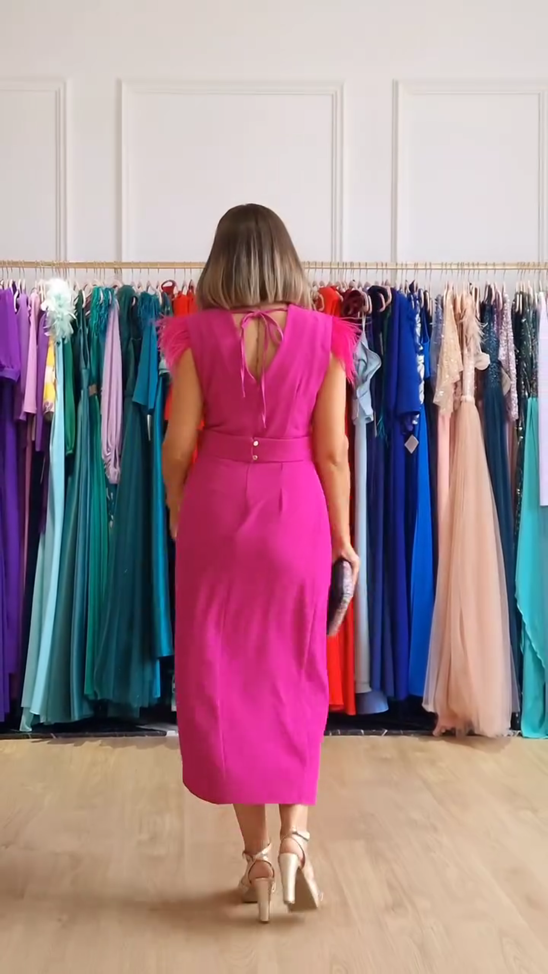 Wrap dress with feathers on the shoulders