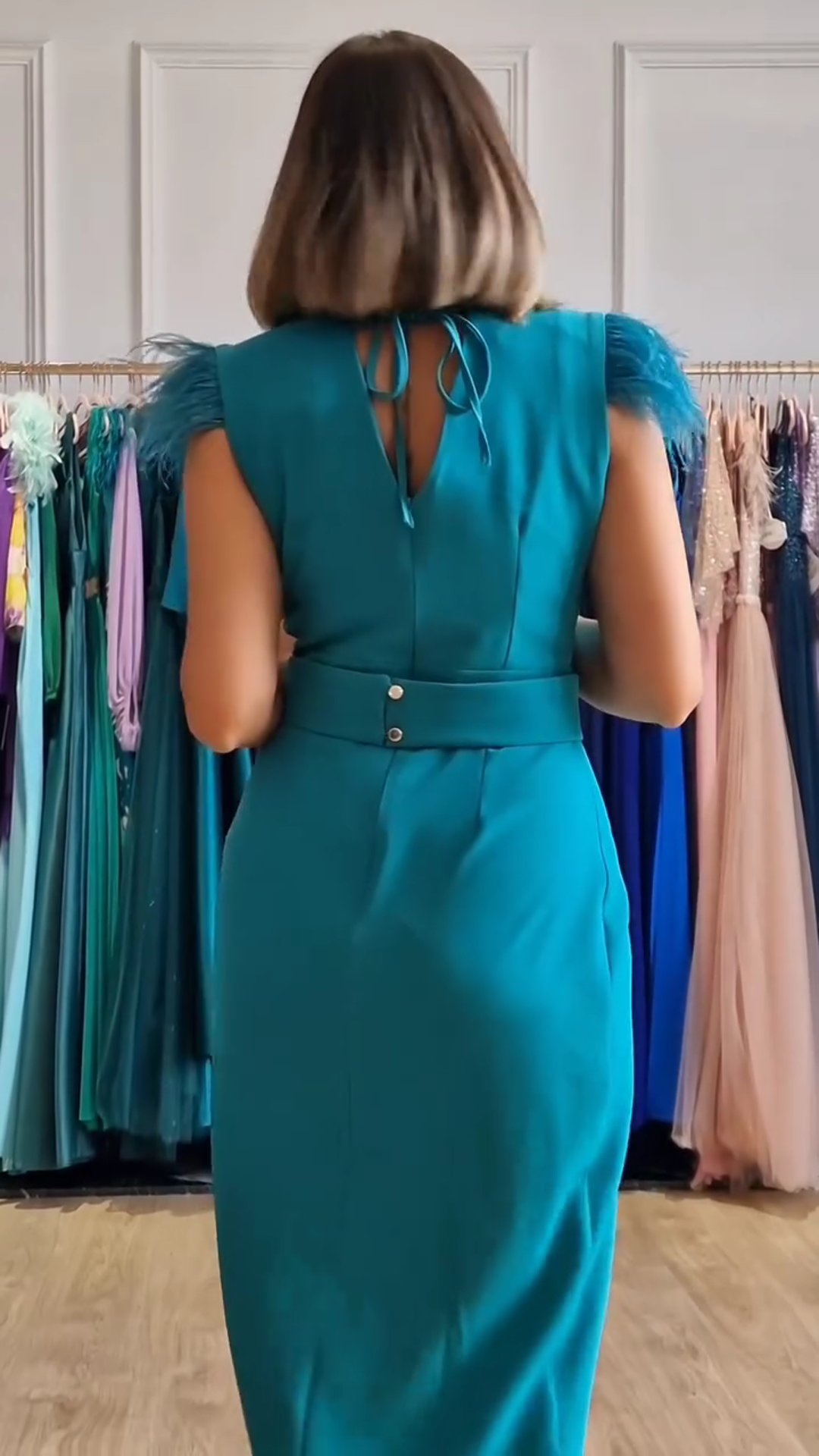 Wrap dress with feathers on the shoulders