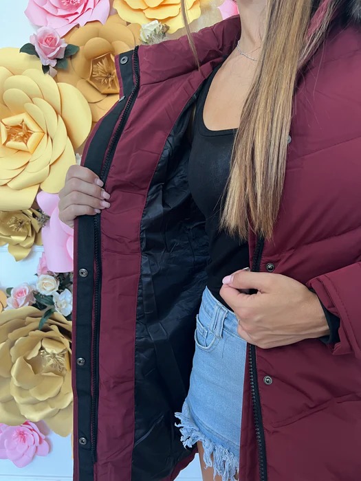 Long down jacket with faux fur hood and adjustable cuffs