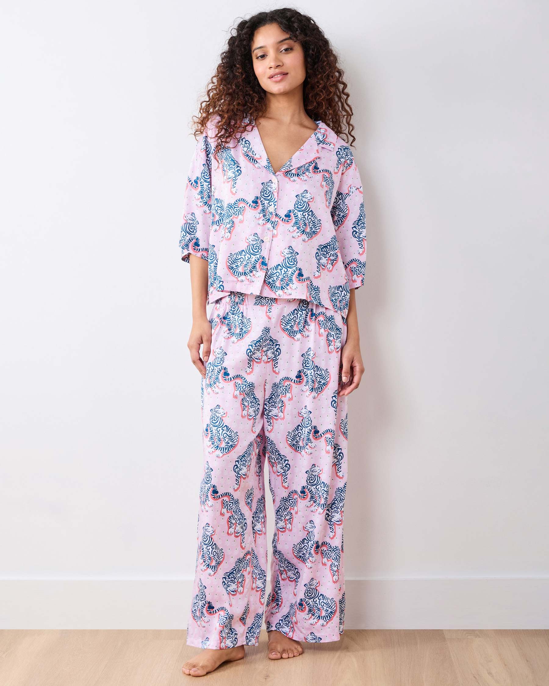 Full-length front view of the blush tiger-print pajama set with three-quarter-sleeve top and wide-leg pants