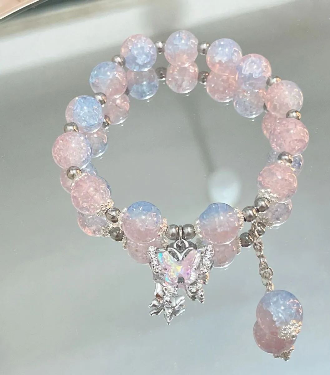 Pink, green, and blue butterfly glaze bracelets with silver charms, perfect for gifting.
